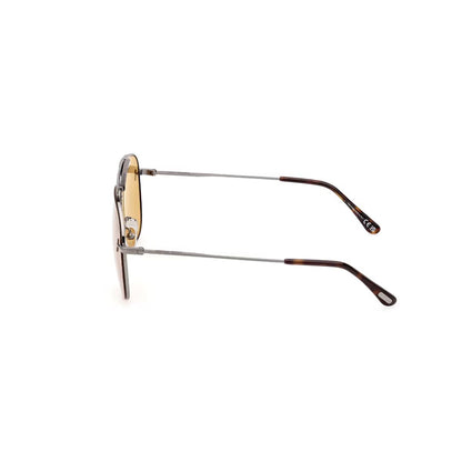 Sunglasses with gold lenses and tortoiseshell arms on a white background