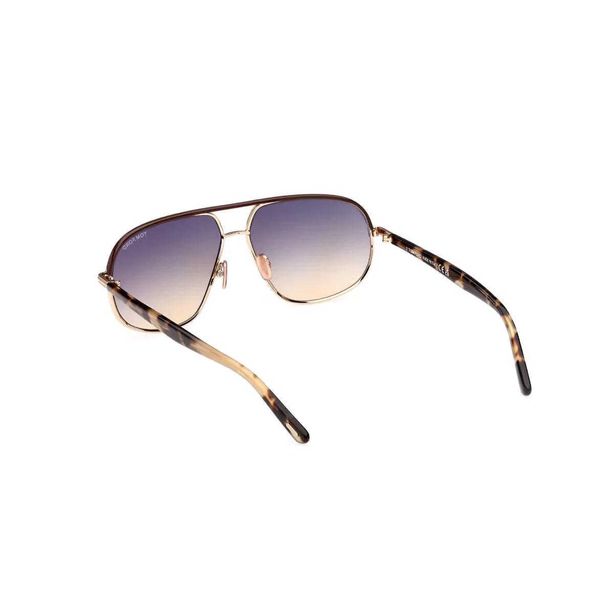 Sunglasses with gradient lenses and tortoiseshell frame on a white background
