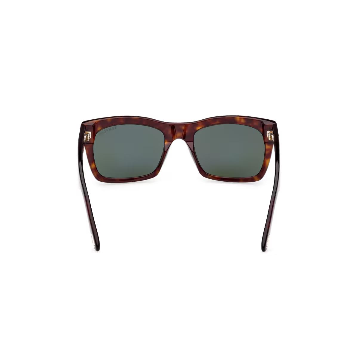 Sunglasses with tortoiseshell frame and dark lenses on a white background