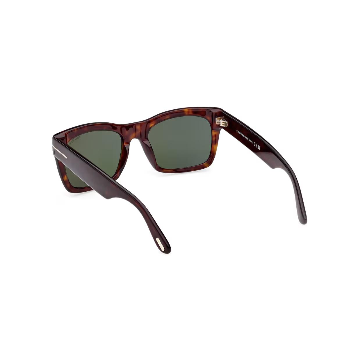 Sunglasses with tortoiseshell frame and gradient lenses on a white background