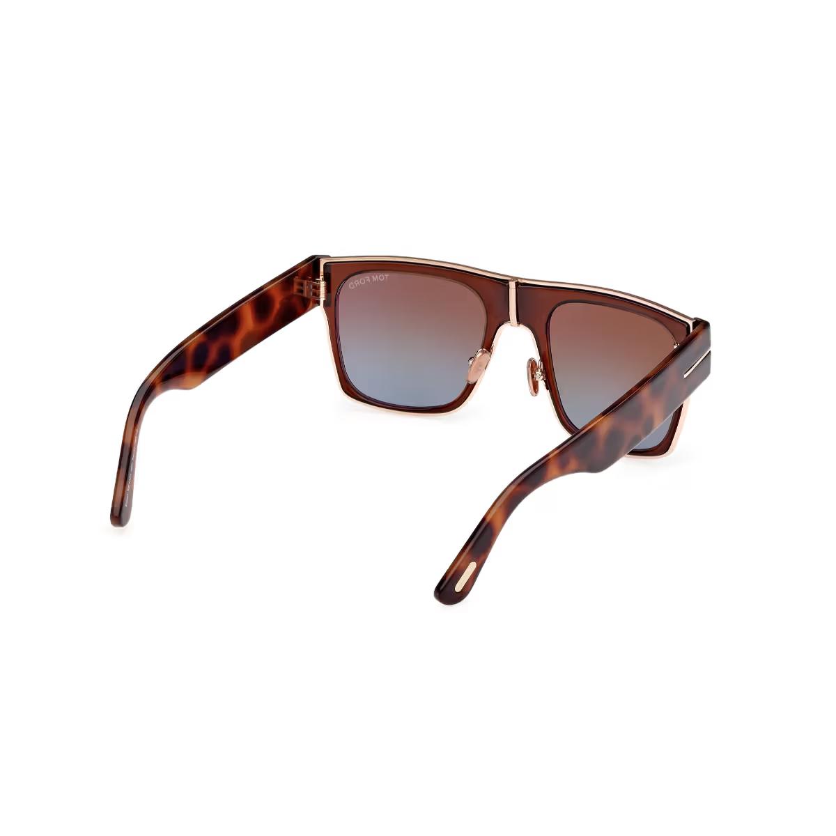 Sunglasses with tortoiseshell frame and brown gradient lenses on a white background