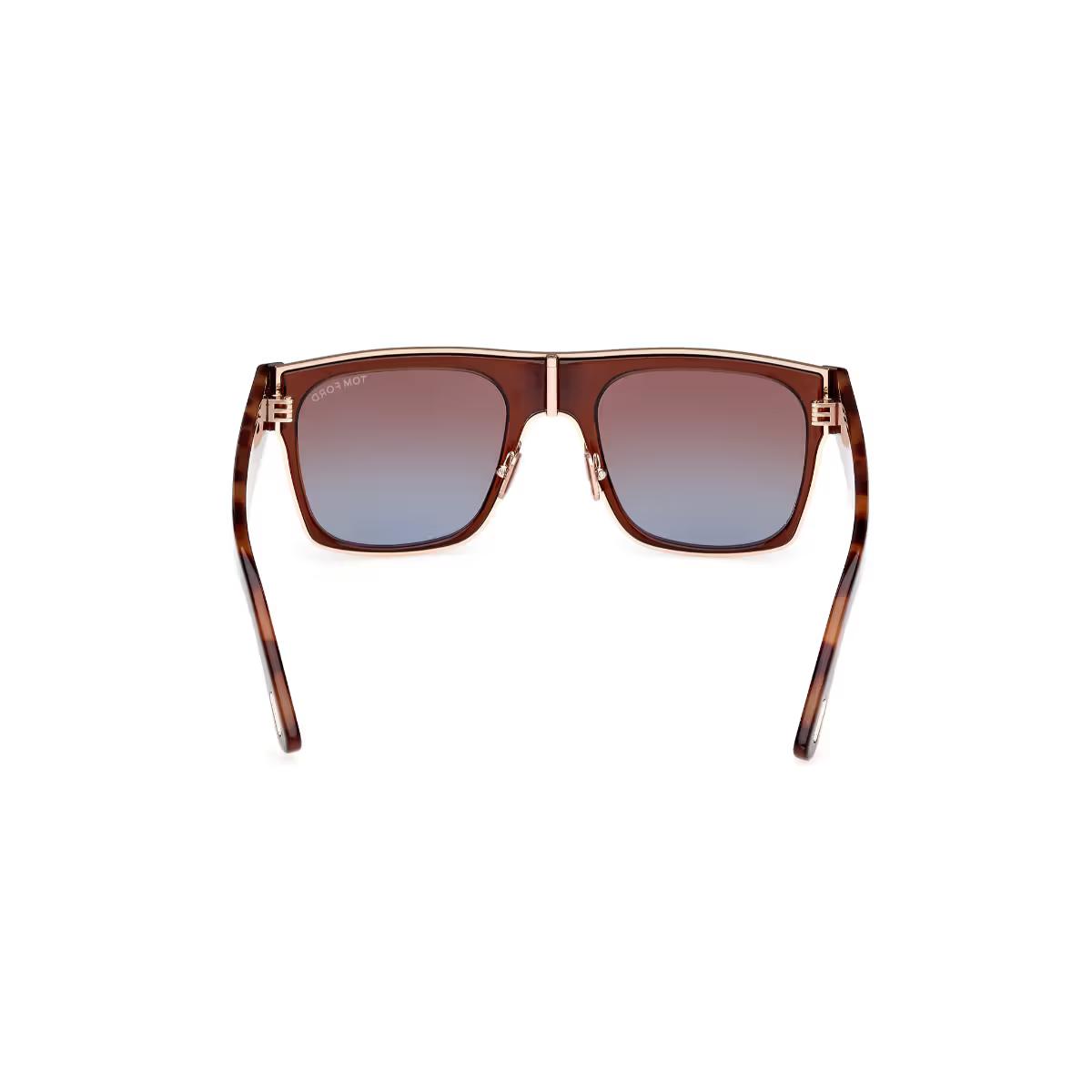 Sunglasses with tortoiseshell frame and gradient lenses on a white background
