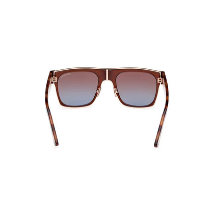 Sunglasses with tortoiseshell frame and gradient lenses on a white background