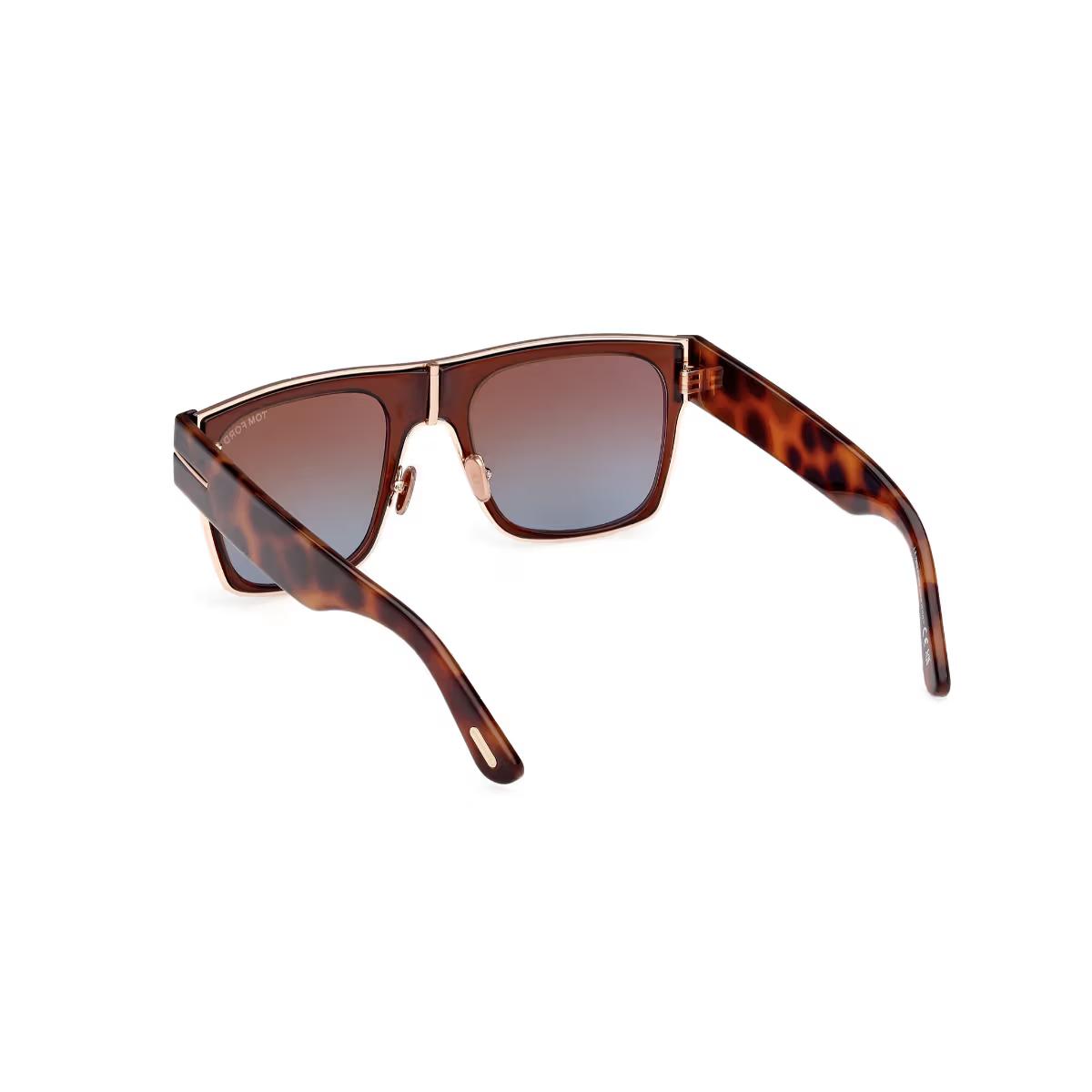Sunglasses with tortoiseshell frame and gradient lenses on a white background