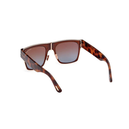 Sunglasses with tortoiseshell frame and gradient lenses on a white background