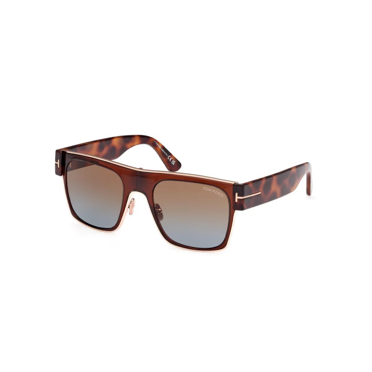 Sunglasses with tortoiseshell frame and gradient lenses on a white background
