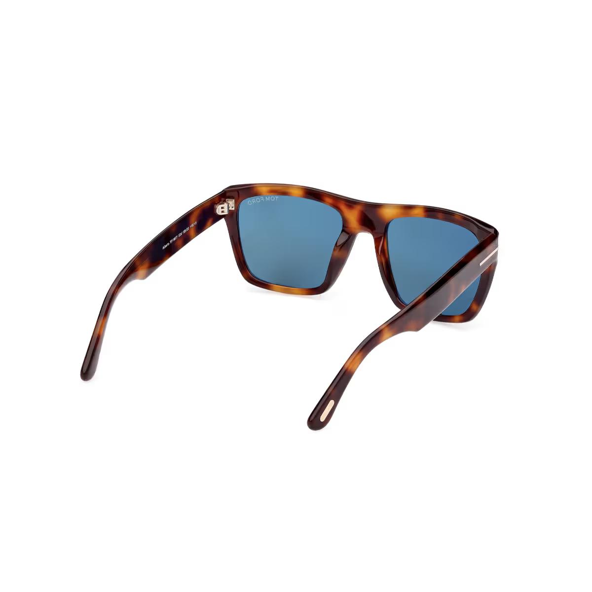 Sunglasses with tortoiseshell frame and blue lenses on a white background