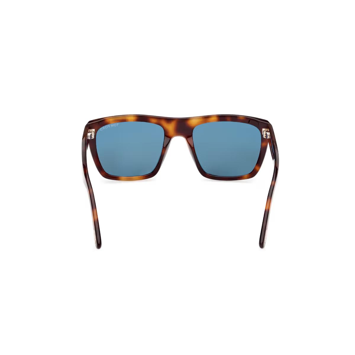 Sunglasses with tortoiseshell frame and blue lenses on a white background