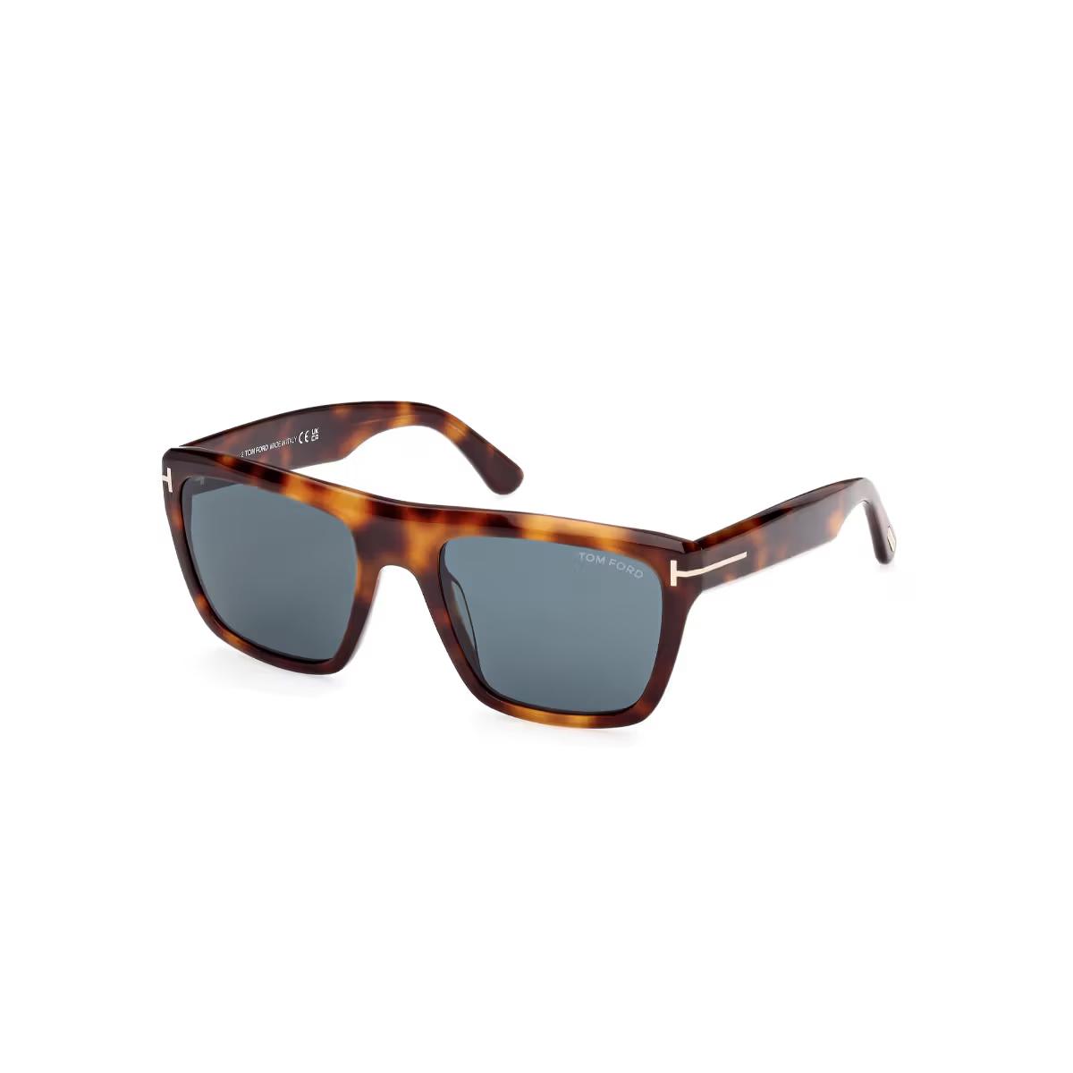 Sunglasses with tortoiseshell frame and dark lenses on a white background
