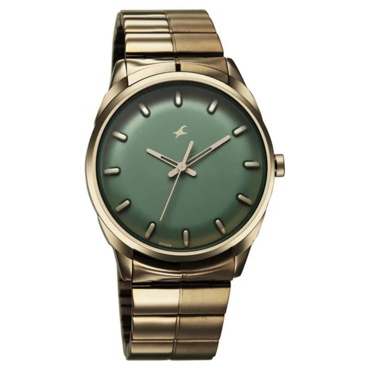 Gold watch with a green face on a white background