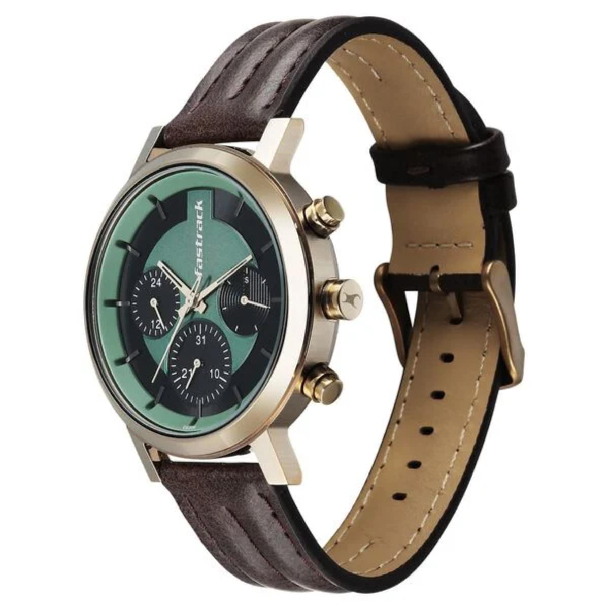 Wristwatch with brown leather strap and green dial on a white background