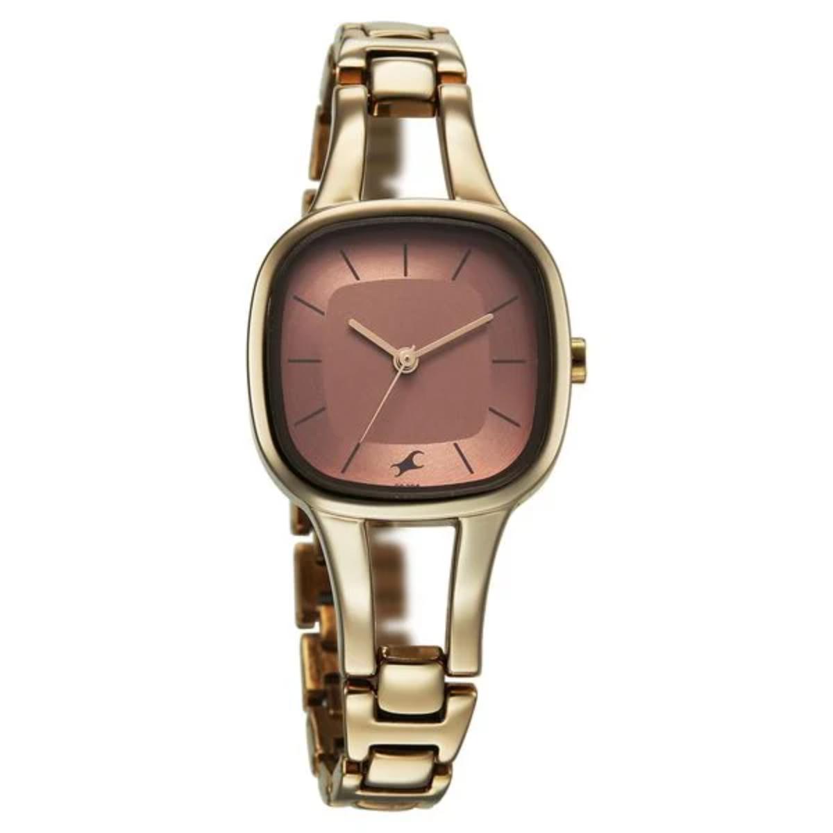 Gold watch with a brown face on a white background
