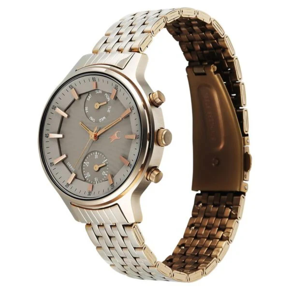 Two-tone watch with gold and silver band on a white background