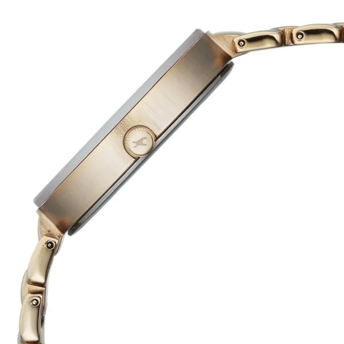 Close-up of a gold watch band on a white background