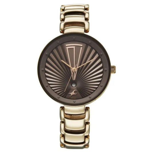 Gold and bronze watch with a detailed face on a white background