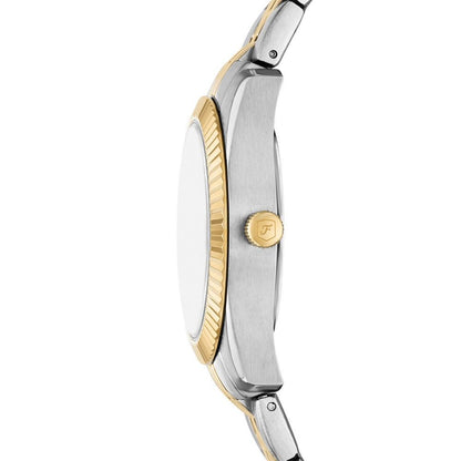 Close-up of a two-tone watch with gold and silver accents on a white background