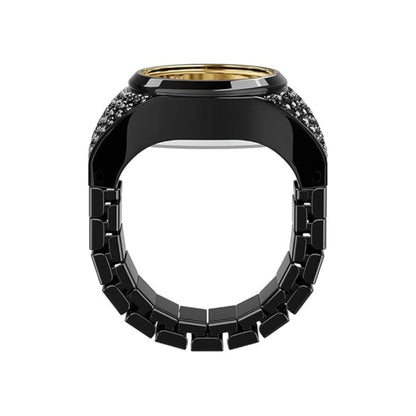 Black and gold ring with gemstone accents on a white background