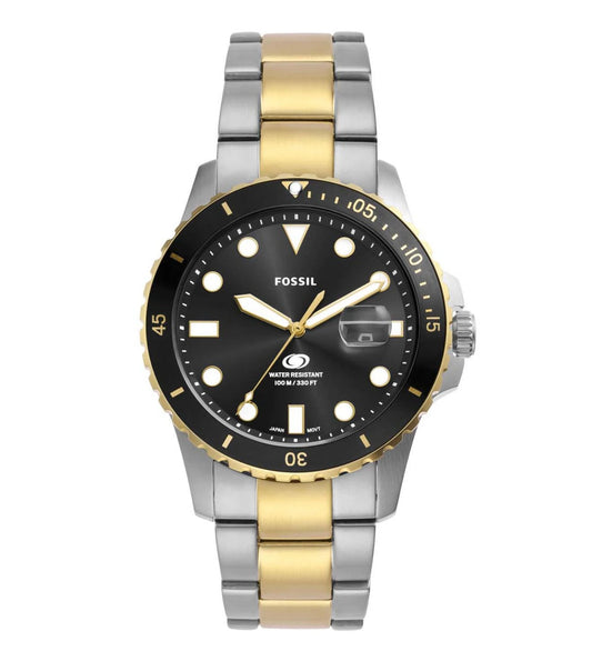 A Fossil dive-style analog watch with a black dial, two-tone stainless steel bracelet, and gold bezel.