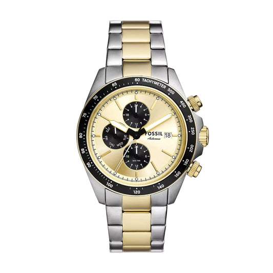 Two-tone Fossil watch with gold and silver band on a white background