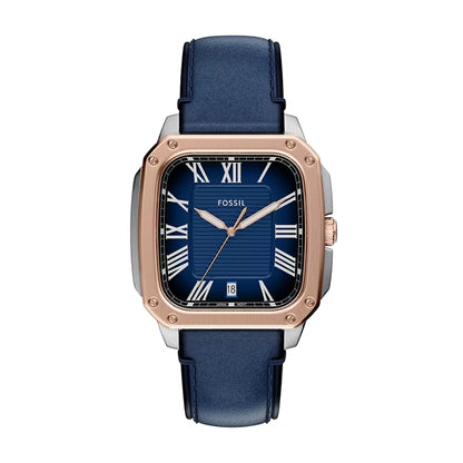 Fossil watch with blue strap and rose gold case on white background