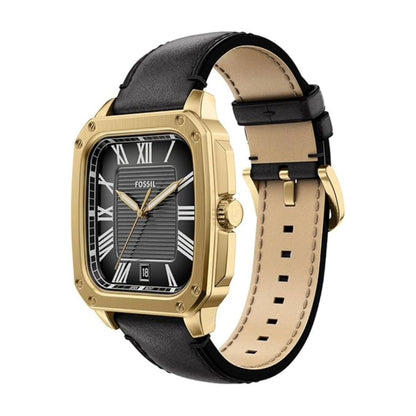 Gold-framed watch with black leather strap on a white background