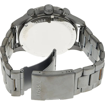 Close-up of a Fossil watch with a metallic band on a white background