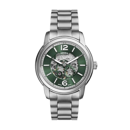 Fossil watch with green face and silver metal strap on white background