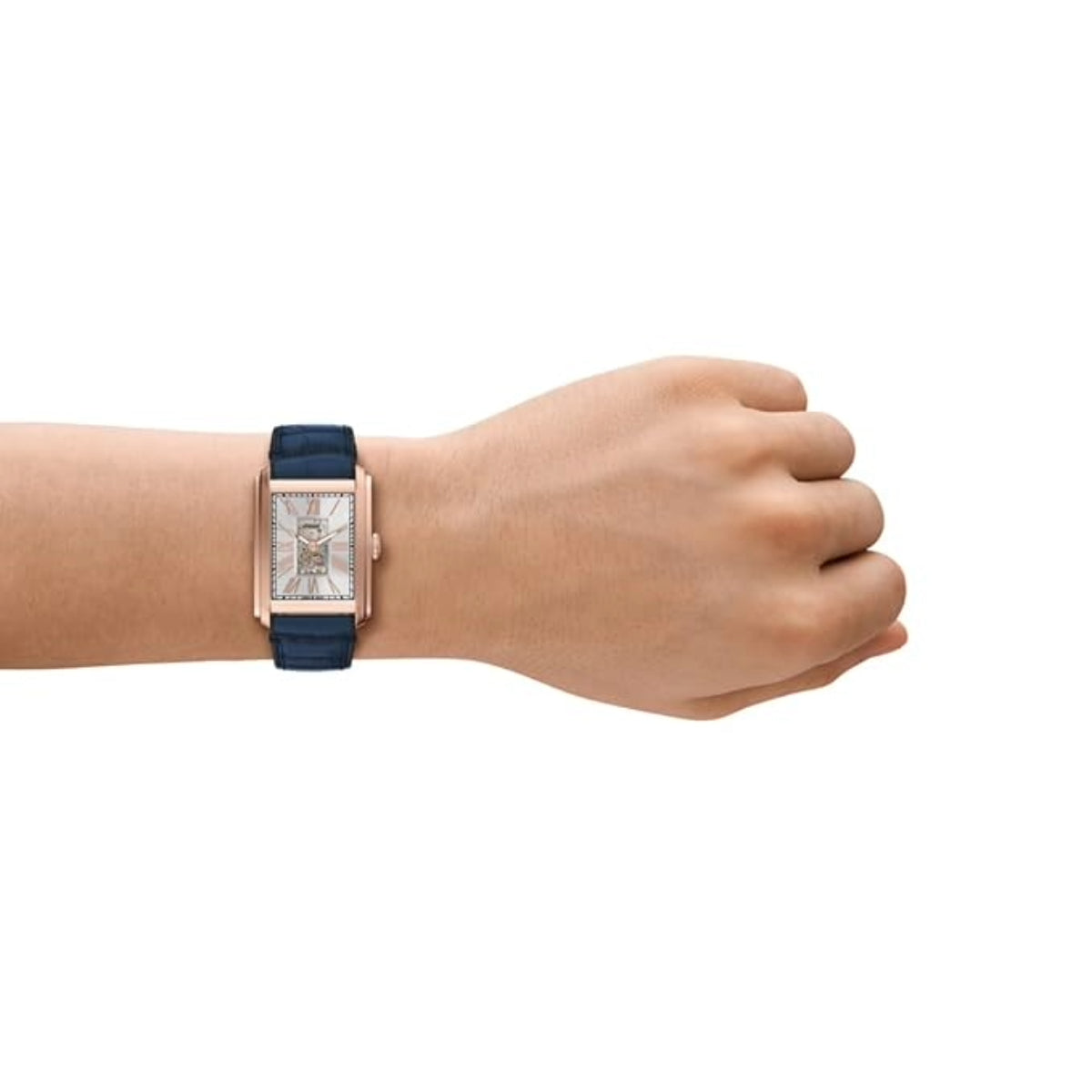 Hand wearing a watch with a blue strap on a white background