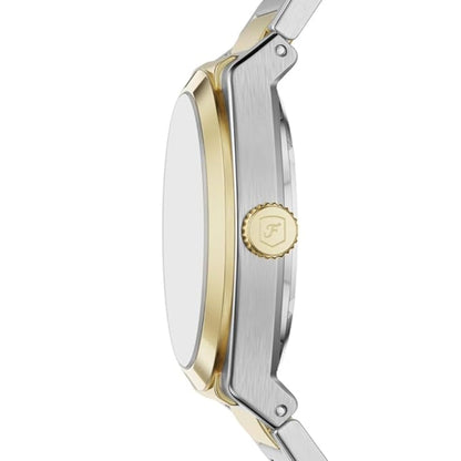 Close-up of a watch with gold and silver band on a white background
