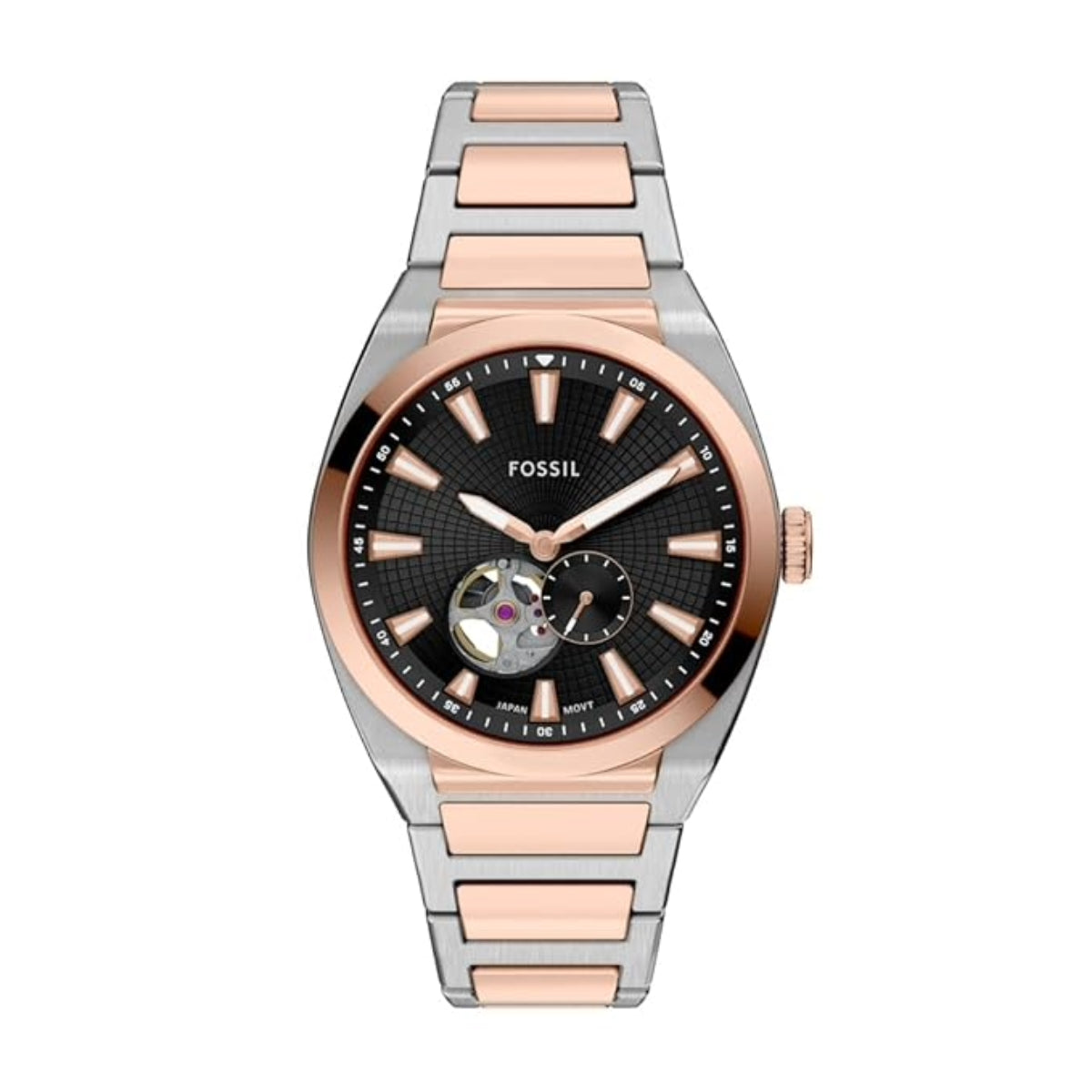 Fossil watch with two-tone rose gold and silver band on white background