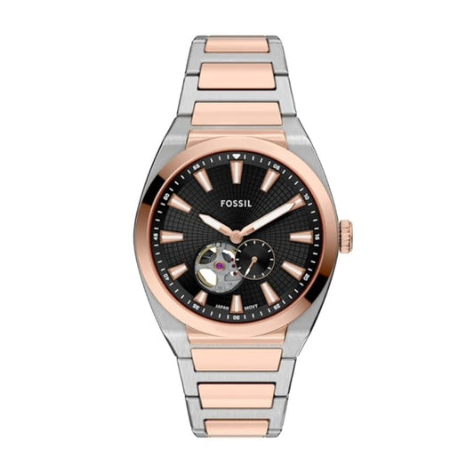 Fossil watch with two-tone rose gold and silver band on white background