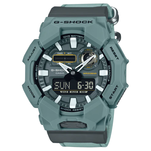 G-Shock watch with a green and gray color scheme on a white background