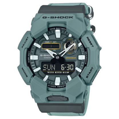 G-Shock watch with a green and gray color scheme on a white background