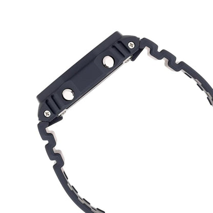 Close-up of a black snowshoe with metal cleats on a white background