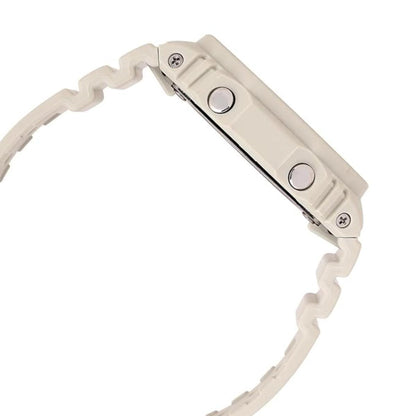 Close-up of a beige wristwatch with a detailed band design on a white background