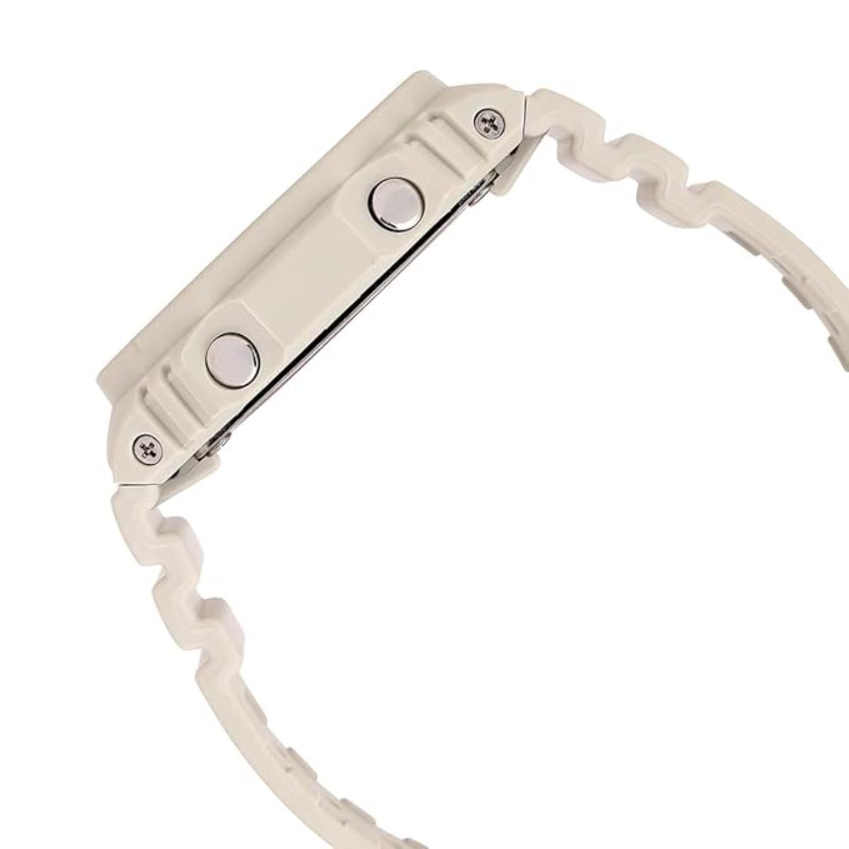 Close-up of a watch with a beige strap on a white background