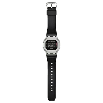 Digital watch with black strap on a white background