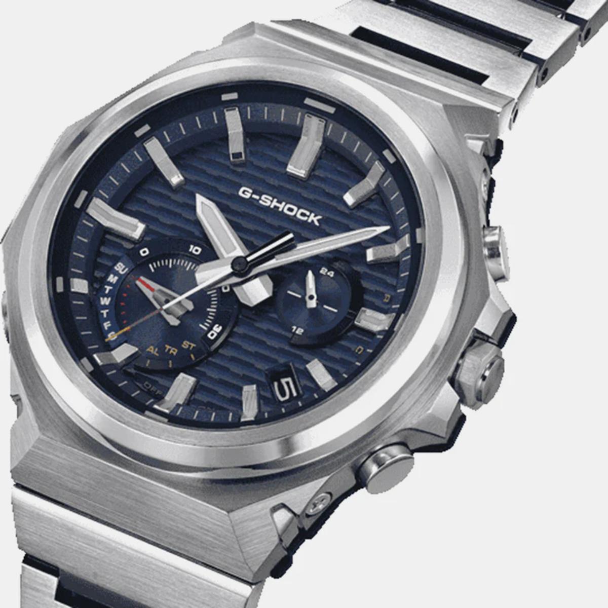 G-Shock watch with silver case and blue dial on a white background