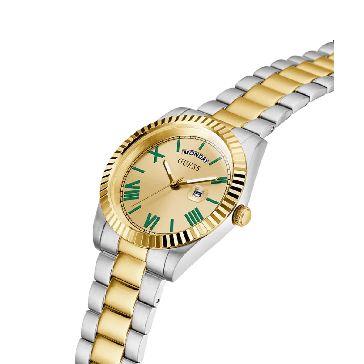 Two-tone gold and silver watch with a gold face on a white background