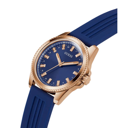 Blue watch with rose gold case on a light gray background