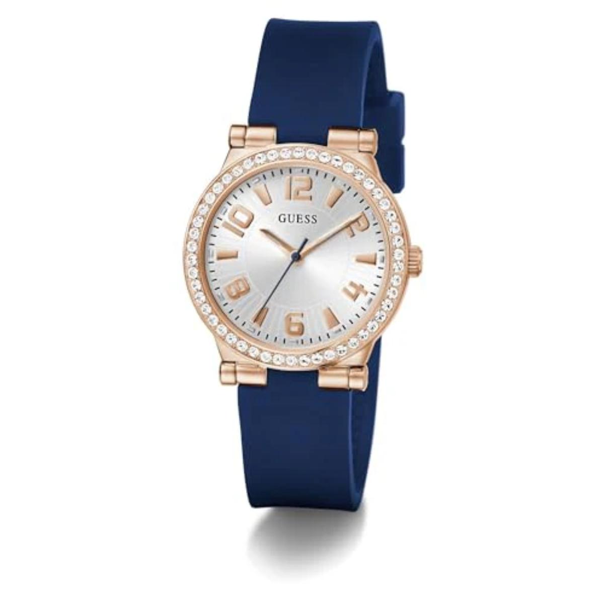 Guess watch with blue strap and rose gold case on white background