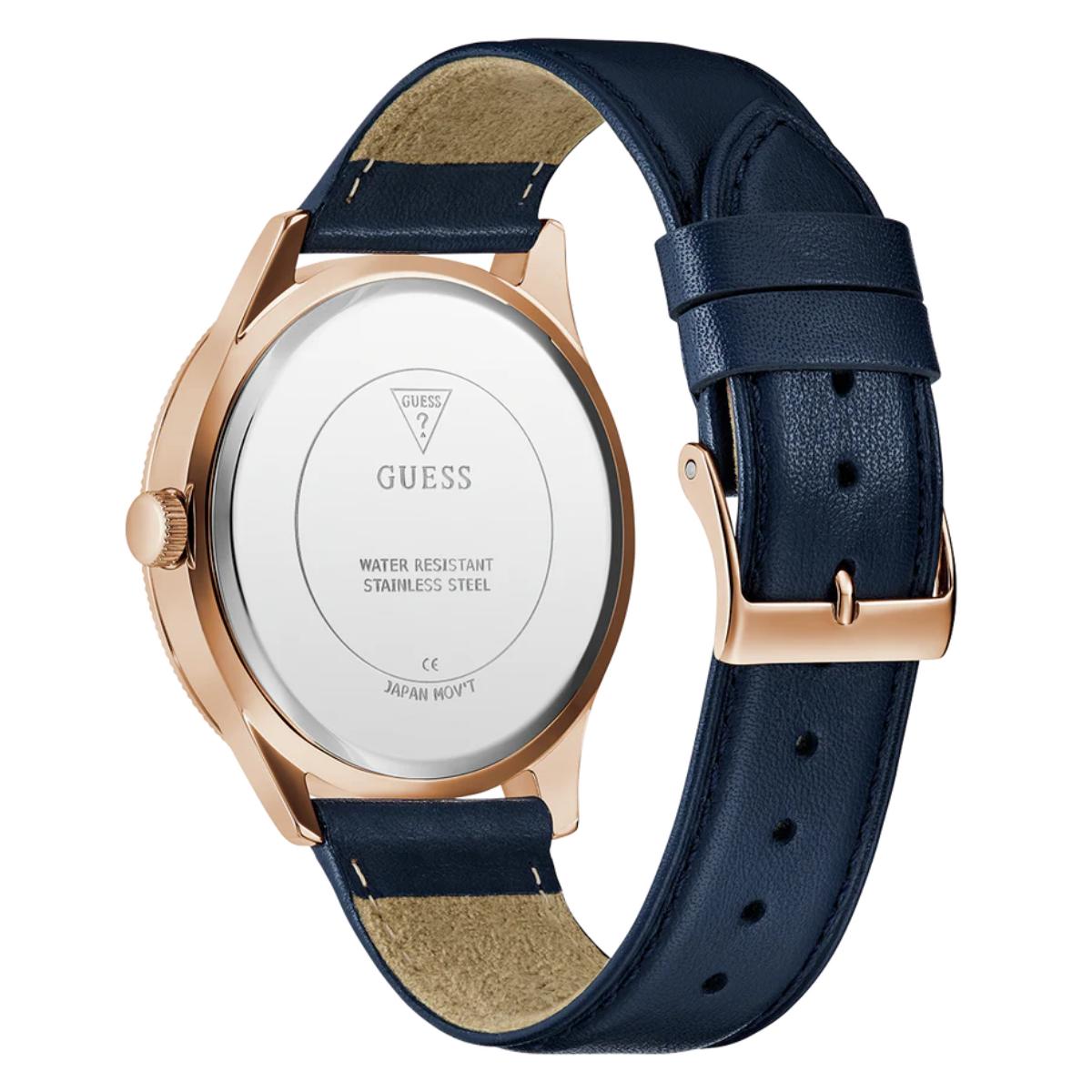 Guess watch with rose gold case and navy blue leather strap on a white background