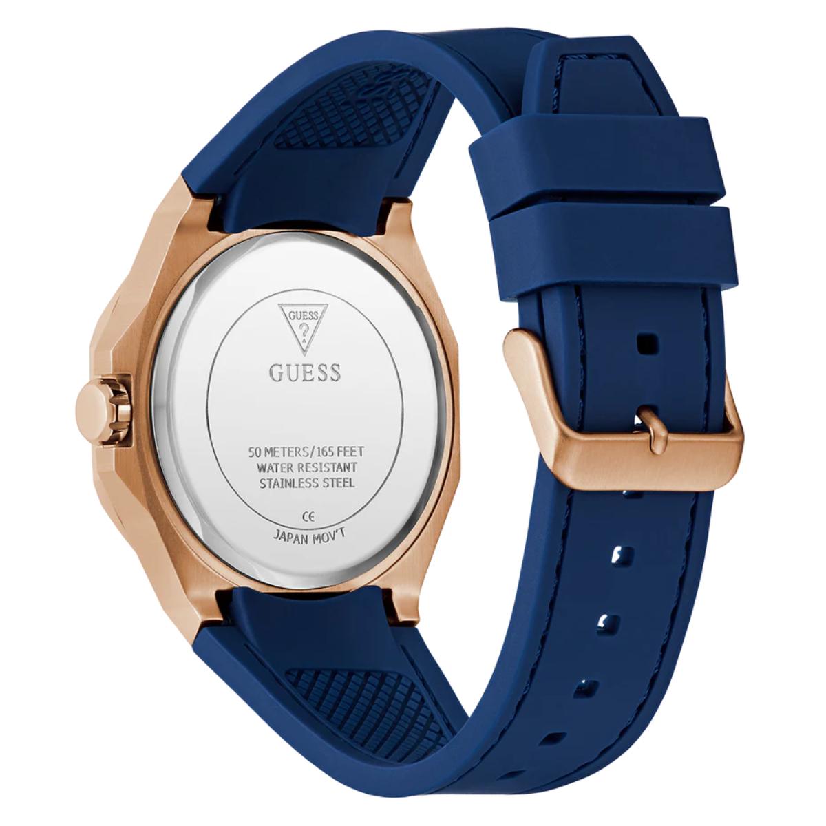 Guess watch with blue strap and rose gold case on white background