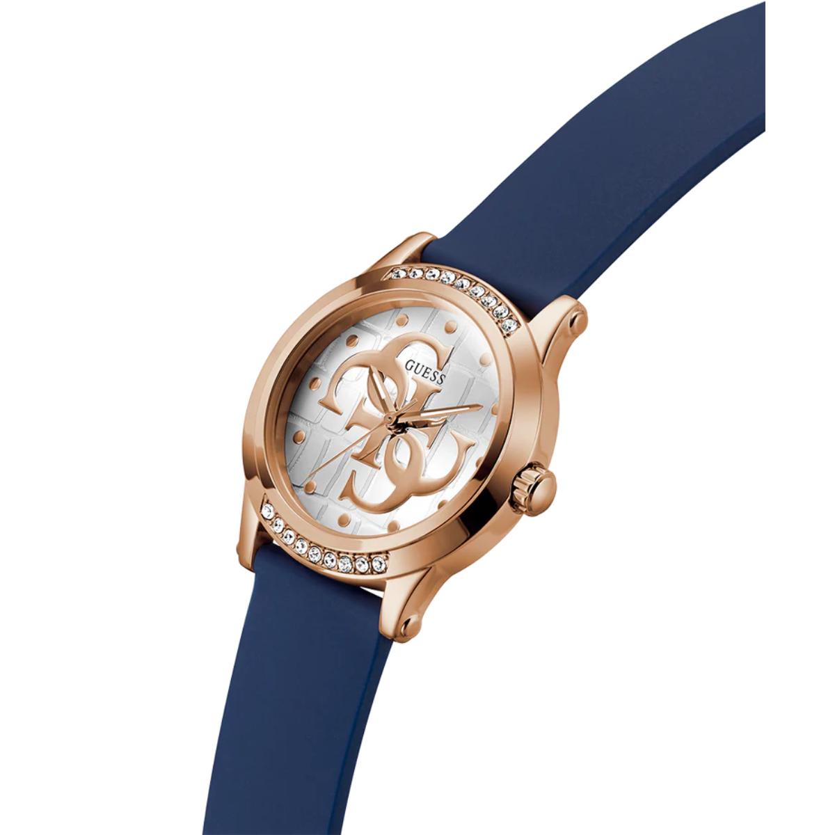 Guess watch with rose gold case and blue strap on a white background