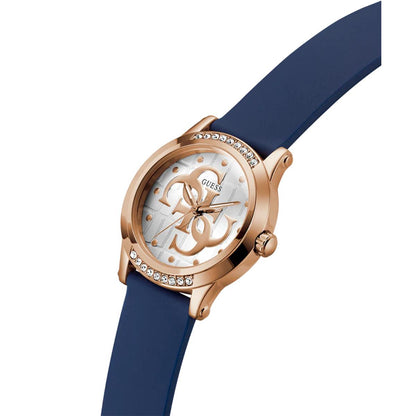 Guess watch with rose gold case and blue strap on a white background