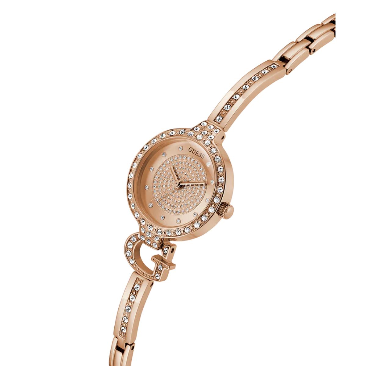 Gold watch with diamond accents on a white background