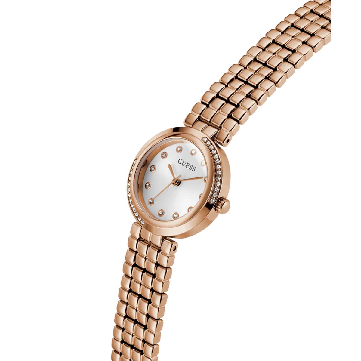 Rose gold watch with a white face on a white background
