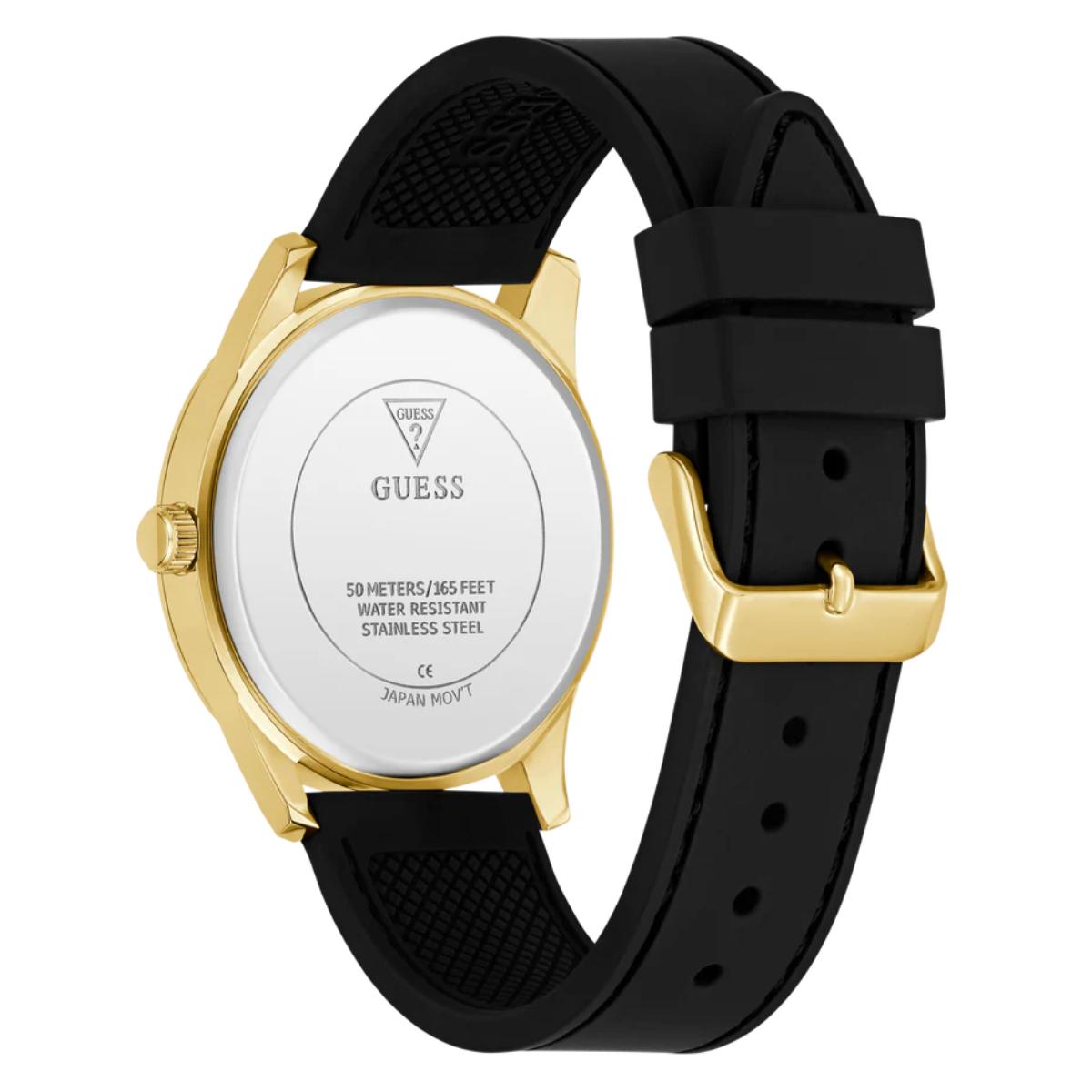 Guess watch with black strap and gold case on a white background