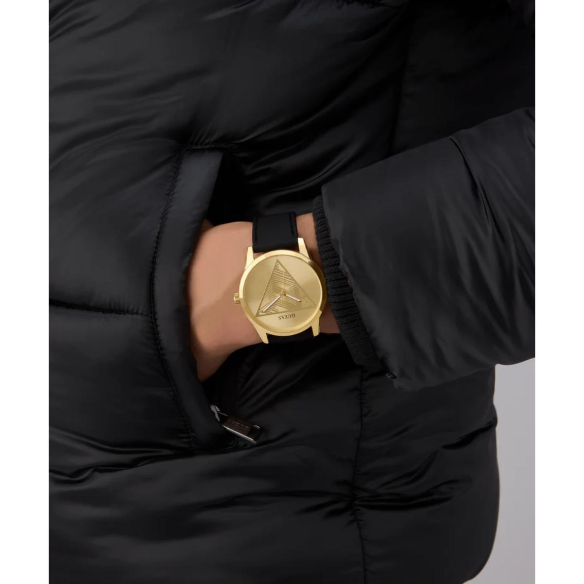 Gold watch on a wrist with a black puffer jacket