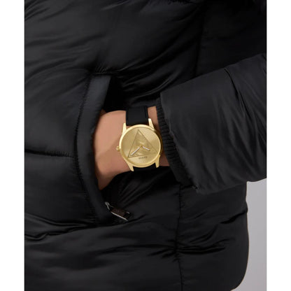 Gold watch on a wrist with a black puffer jacket